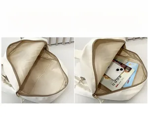 Detail view showing the spacious interior compartment of the white nylon kids backpack