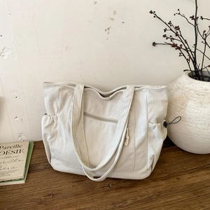 Minimalist beige corduroy tote bag with large capacity and stylish vertical stripe texture