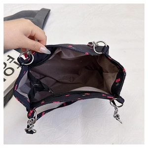 Close-up of cherry print tote bag interior with large capacity and zipper closure