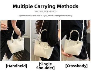 Three ways to wear this cream leather bucket bag: hand-held, shoulder, and crossbody