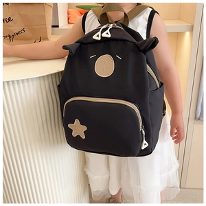 Detailed back view of a black cute bear-ear toddler backpack worn by a young girl