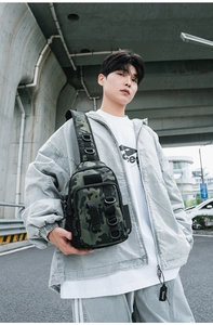 Tactical camouflage shoulder bag worn by model featuring multiple D-rings and Molle webbing