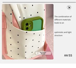 Detail view of the side pocket on a star pattern backpack with a mobile phone inside