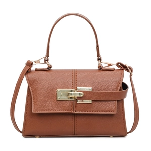 Minimalist brown leather shoulder bag with gold buckle for women in caramel brown