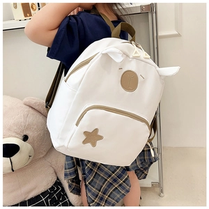 Detail showing the cute bear embroidery, 3D animal ears and star patch on a kids backpack
