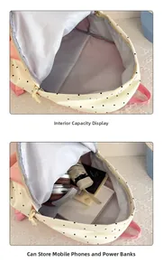 Internal storage view of star patterned backpack showing space for books and headphones