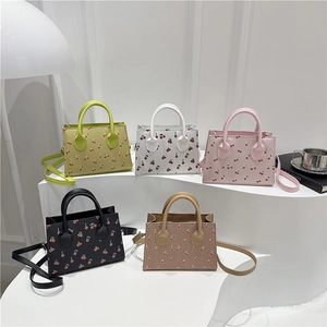Chic cherry print tote bags in five pastel colors with detachable crossbody straps