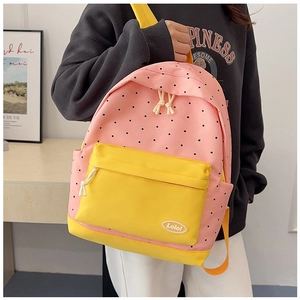 Pink polka dot canvas backpack with yellow pocket and Lolo logo in a campus style