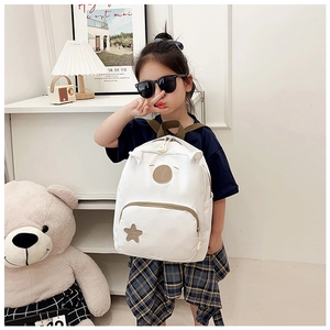 Detail view of children canvas backpack with cute 3D ears and star embroidery accents