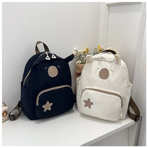 Close-up of waterproof cartoon kids backpack with cute animal ears and star patches