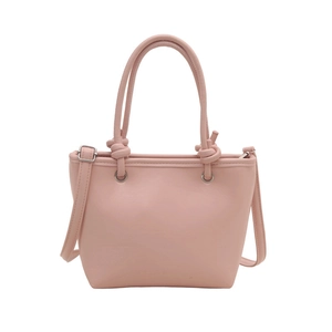 Pink faux leather bucket tote bag with knot handles and adjustable shoulder strap