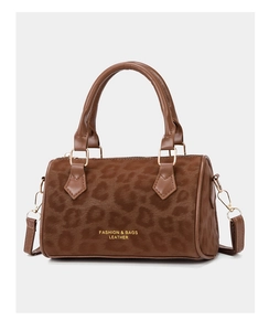 Close-up of leopard print suede texture and gold metal hooks on a Boston bag