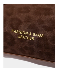 Detail of suede leopard print bag featuring gold Fashion & Bags Leather lettering