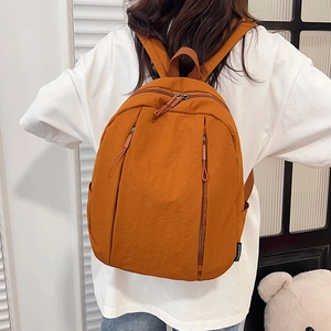 Minimalist large-capacity orange casual backpack with durable fabric for daily commute