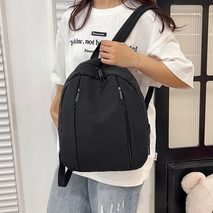 Classic black casual backpack with large capacity and waterproof nylon material for daily use