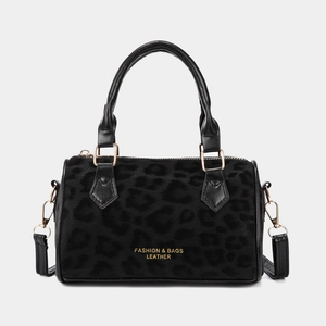 Vintage leopard print suede bucket bag with gold hardware and dual black leather handles