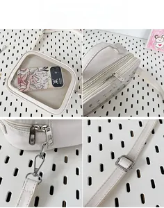Detailed views of white Ita bag with transparent PVC window and adjustable strap