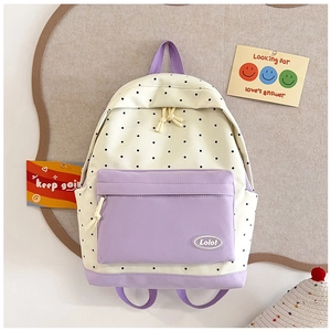 Detailed view of beige backpack with purple star accents and the Lolo logo on the front