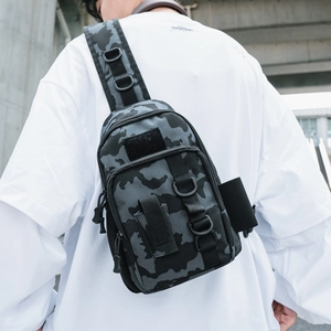 Tactical sling bag in dark grey camo nylon with D-rings and Molle system for outdoors