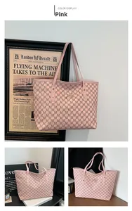 Detail of pink tote bag showing M-letter monogram print and golden metal bow