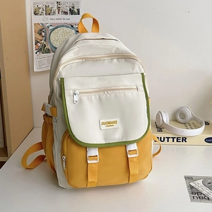Detail of Korean-style canvas backpack showing contrasting pockets and side buckles