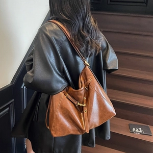 Retro brown leather hobo bag with gold hardware and large capacity for daily use