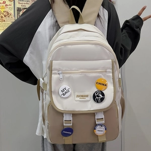 Student school backpack in cream and khaki patchwork design with aesthetic badges