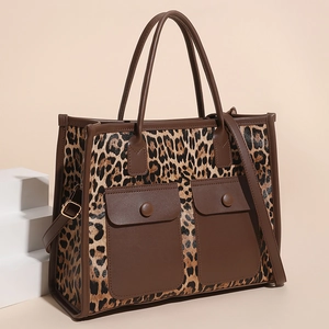 Large leopard print tote bag with brown faux leather trim and dual front flap pockets