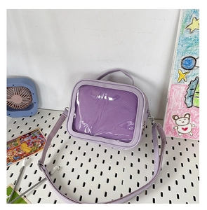 Detail view of purple ita bag with transparent PVC window and adjustable strap