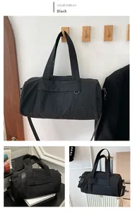 Detail of durable black nylon travel bag showing heavy-duty straps and side metal D-ring