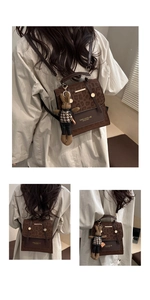 Detailed view of leopard print faux suede backpack with gold hardware and bunny charm