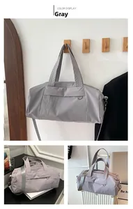 Detailed views of grey nylon duffel bag with detachable strap for travel and fitness