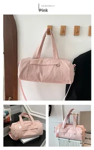 Pink quilted nylon gym bag featuring multi-way carry straps and spacious design