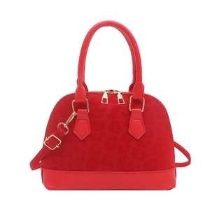 Fashionable red shell handbag with leopard texture and gold hardware detailing