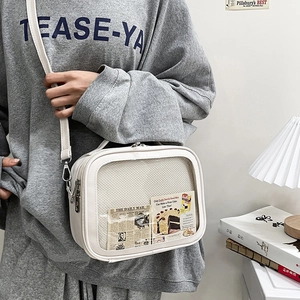 White leather crossbody ita bag with clear window and silver zipper for women
