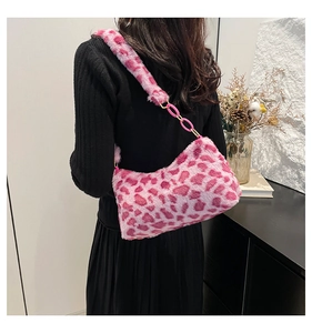 Detail of pink leopard print plush shoulder bag with stylish metal chain strap