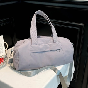Large lavender nylon travel duffel bag with detachable shoulder strap for gym and fitness