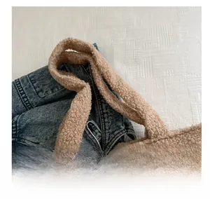 Close-up of the plush faux fur texture and comfortable handle on the beige tote bag