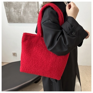 Detail showing the vibrant red faux fur texture and soft grain of this tote bag