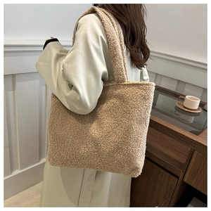 Detail of plush fleece texture on beige large capacity tote bag for women