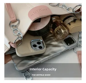 Internal view of beige tote bag with large capacity for laptop, phone, and cosmetics