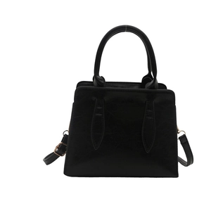 Classic black leather handbag for women with dual handles and gold metallic hardware accents