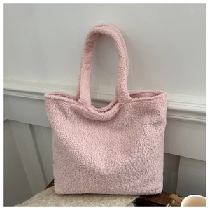 Detailed macro view of the soft pink plush lamb wool fabric on a large tote bag