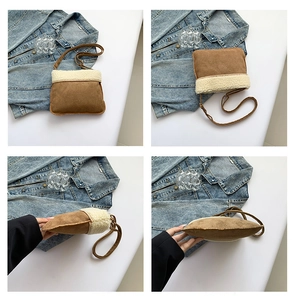 Detail view of winter brown suede crossbody bag with white plush trim and adjustable strap