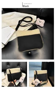 Detail of black velvet crossbody bag with white shearling trim and cute bear charm