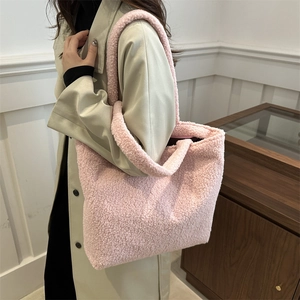 Pink plush faux fur tote bag with a soft texture, large capacity, and cozy shoulder straps