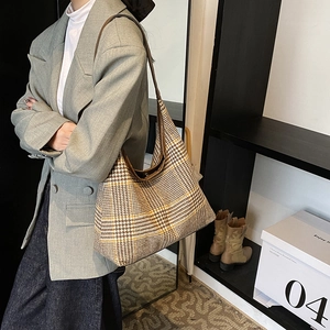 Classic houndstooth tote bag in brown and yellow with spacious interior for daily use