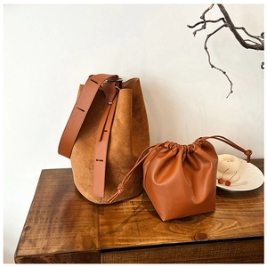 Two-piece set with brown matte suede bucket bag and smooth drawstring inner pouch