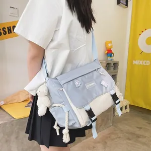 Minimalist dark aesthetic messenger bag in light blue and cream white color block style