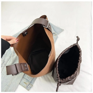 Top view of vintage matte bucket bag with a brown drawstring inner pouch set